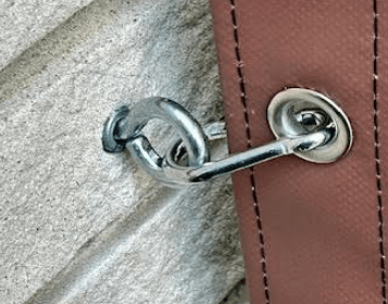 Fastening a tarp grommet to brick